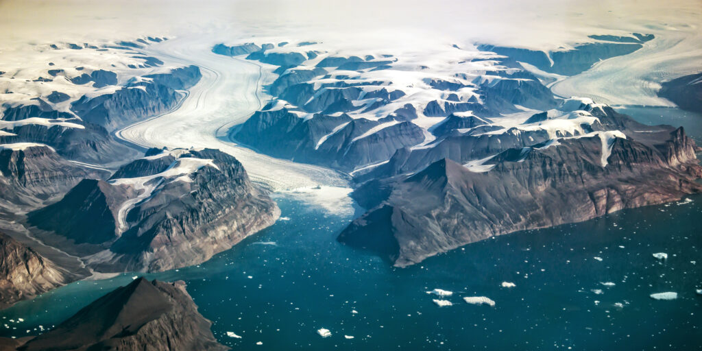 Western coast of Greenland, aerial view of glacier,  mountains and ocean